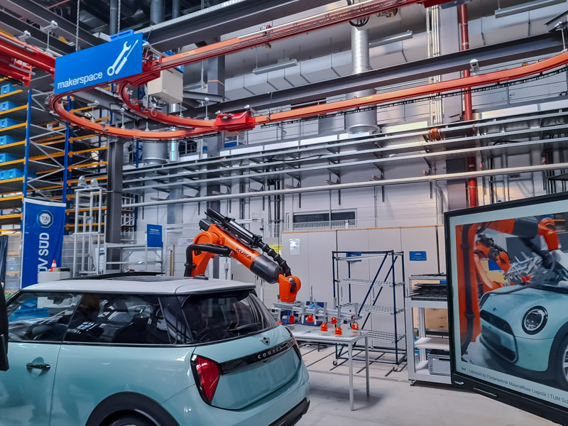 A KUKA robot at work in the automotive industry.