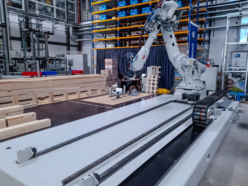 Human-machine interaction. A robotic arm assists with precise wood milling operations – leading to greater efficiency and better-quality products. This is a perfect example of how humans and technology can work hand in hand.